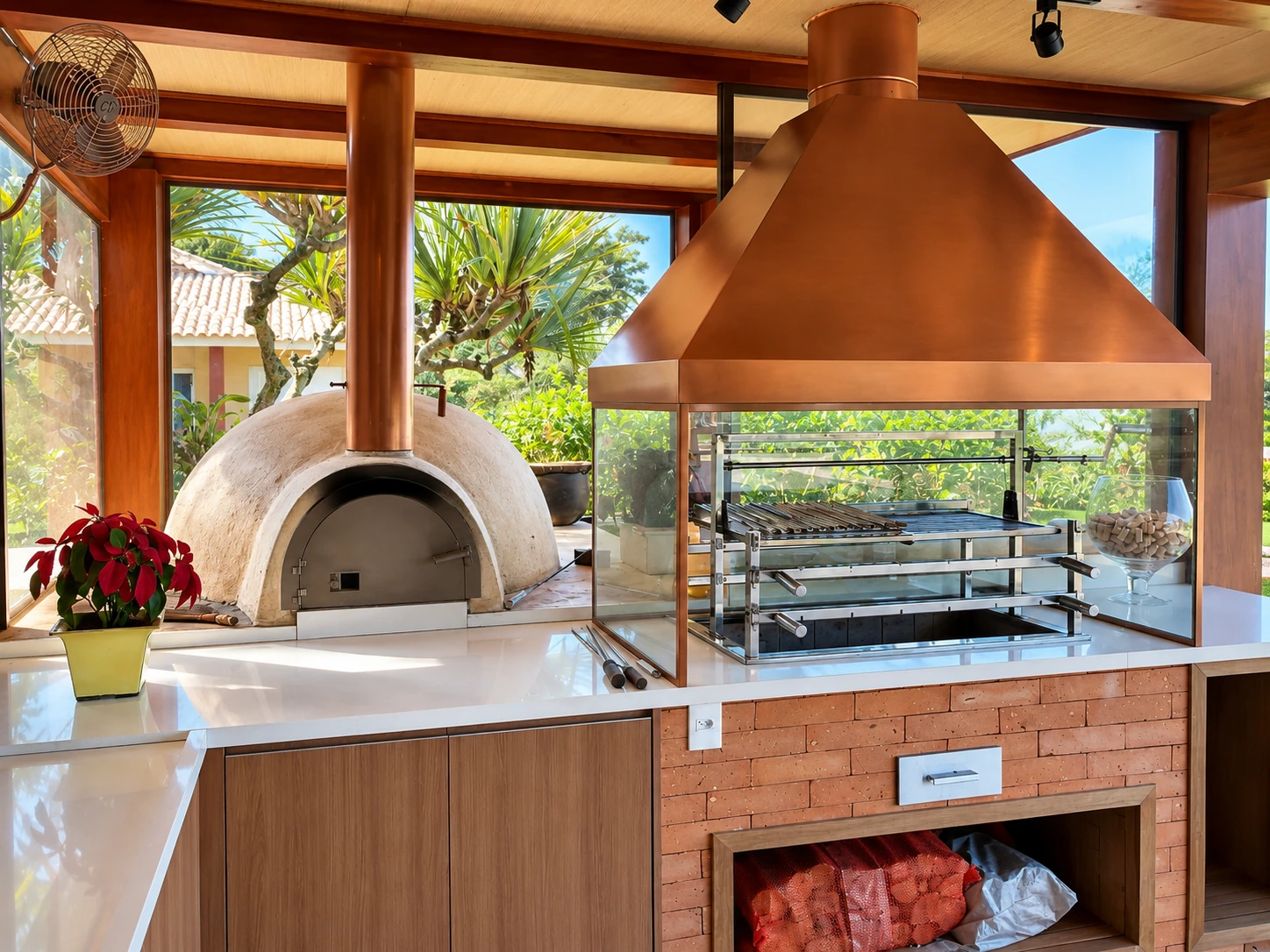Coifa cobre, forno de pizza e churrasqueira em área gourmet